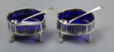 A pair of George III silver oval salts, William Skeen? London, 1778 and a pair of associated