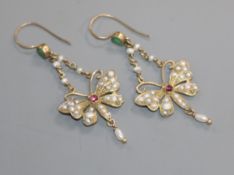 A pair of yellow metal, emerald, garnet and seed pearl set butterfly drop earrings, stamped 9ct,