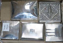 Five assorted silver cigarette boxes, largest 12.8cm.