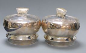A pair of Indian 925 white metal bowls and covers by Ravissant, the covers with lucite handles,