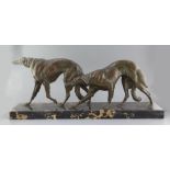 Louis Riché. A French Art Deco bronze group of two borzoi, on a veined black marble plinth,
