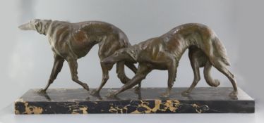 Louis Riché. A French Art Deco bronze group of two borzoi, on a veined black marble plinth,