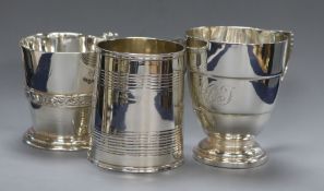 A Victorian silver christening mug, London 1871 and two others including Art Deco by Mappin &