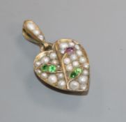 A yellow metal, green garnet, ruby and split pearl set heart shaped pendant, stamped 9ct, overall