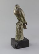 Irénée Rochard (1906-1984). A green patinated bronze model of a falcon perched upon a tree stump,