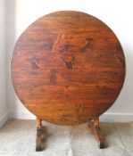 A 19th century French Vendange dining table in pine, cherry and oak Diameter 100cm