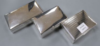 Three assorted silver cigarette boxes, largest 16.3cm.