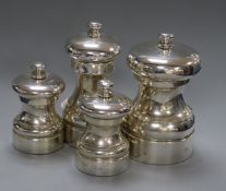 Four assorted modern silver mounted pepper mills including a pair, largest 10.5cm.