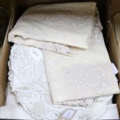 A collection of Madeira and other lace-edged and embroidered table linen, including a circular cream