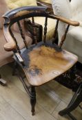 A Victorian beech and elm smoker's bow armchair