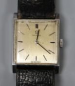 A lady's stainless steel Omega square dial manual wind wrist watch.