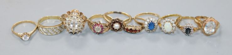 Ten assorted 9ct gold and 9ct yellow metal gem set dress rings.