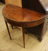 A George III mahogany demi-lune folding top card table W.91.5cm