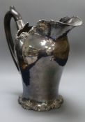 A large white metal jug with vineous border, 21.5cm.