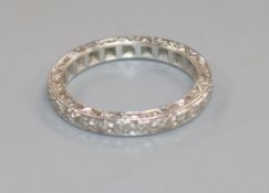 A white metal and diamond set full eternity ring, size P.