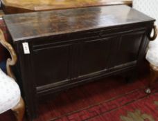 A 17th/18th century panelled oak coffer W.120cm