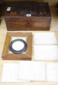 A parquetry writing box, a collection of plaster plaques and another plaque