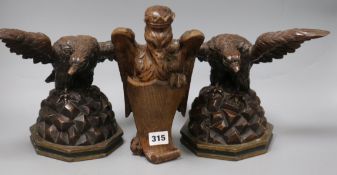 A pair of carved 18th century eagles and a carved bird church ornament tallest 26cm