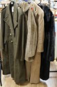 A Vivienne Westwood camel coat, size 42, a khaki greatcoat, a long black faux fur coat and a faux