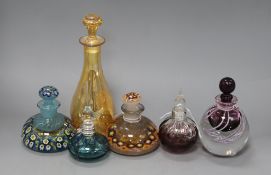 Two millefiore glass paperweight inkwells, three coloured glass scent flasks (two silver-mounted)