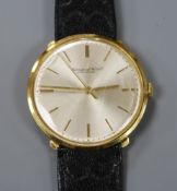 A gentleman's 18ct gold International Watch Co. manual wind wrist watch, on associated leather