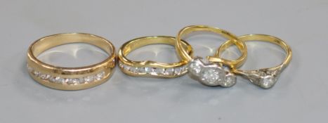 Four assorted diamond set dress rings including three 18ct gold.