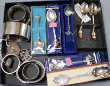 A small collection of silver and plated items, including two silver bangles, a silver 'belt'