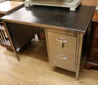 A 1960's single pedestal steel desk, stripped, polished and lacquered W.107cm
