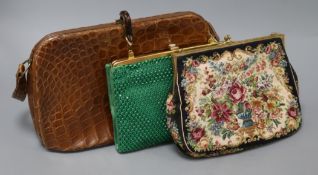 A vintage ladies crocodile skin handbag and purse, a green-paste set evening bag and a tapestry