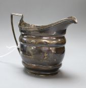 A George III silver helmet shaped cream jug, London, 1801, 10cm.