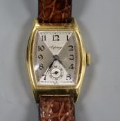 A lady's 1930's 18ct gold tonneau shaped manual wind wrist watch retailed by Asprey, on later