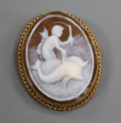 A 9ct gold-mounted cameo brooch carved with a putti riding a pair of dolphins, 55mm.