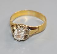 A yellow metal and claw set solitaire diamond ring, (stone a.f.), size P.