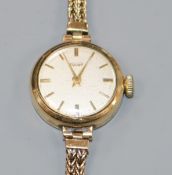 A lady's Tissot wristwatch on integral 9ct gold double chain bracelet
