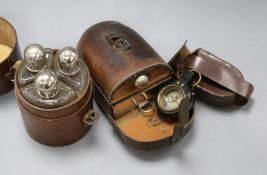 A leather cased flask and box, similar triple spirit flasks and an early 20th century compass
