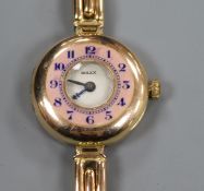 A lady's early 20th century 9ct gold and enamel Rolex manual wind wrist watch, on a 9ct gold