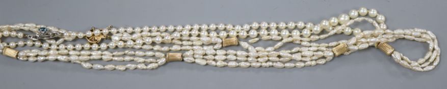 A single strand graduated cultured pearl necklace with zircon and diamond set clasp and one other