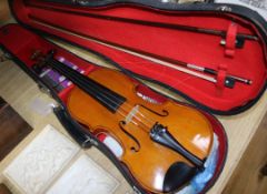 A full size violin and two bows