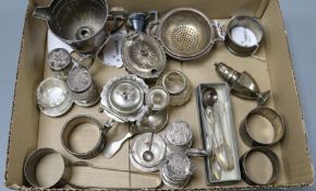 A group of silver and silver-mounted condiments, napkin rings, spoons and sundries, comprising a