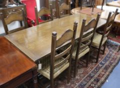 An oak refectory table and six chairs W.183cm