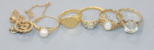 A diamond solitaire ring, 18ct gold shank, an 18ct gold signet ring, three 9ct gold rings and a