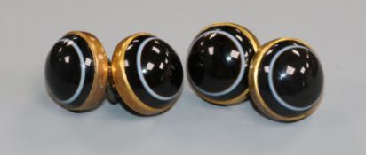 A pair of yellow metal and cabochon banded agate cufflinks.