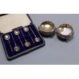 A pair of Victorian silver bun salts, Sheffield, 1877 and cased set of six silver coffee spoons.