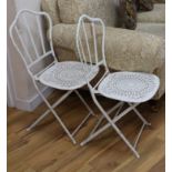 A pair of folding garden chairs