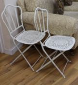 A pair of folding garden chairs