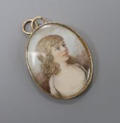 A yellow metal mounted oval miniature oval portrait pendant, painted with the bust of a lady, 35mm.