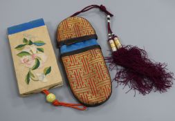 A 19th century Chinese embroidered silk spectacle case and a similar purse