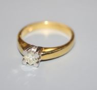 A modern 750 yellow metal and solitaire princess cut diamond ring, size O.