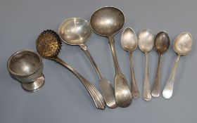A George IV silver sifter spoon, a William IV silver sauce ladle, a silver egg cup and five plated