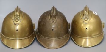 Three French fire helmets 20cm high